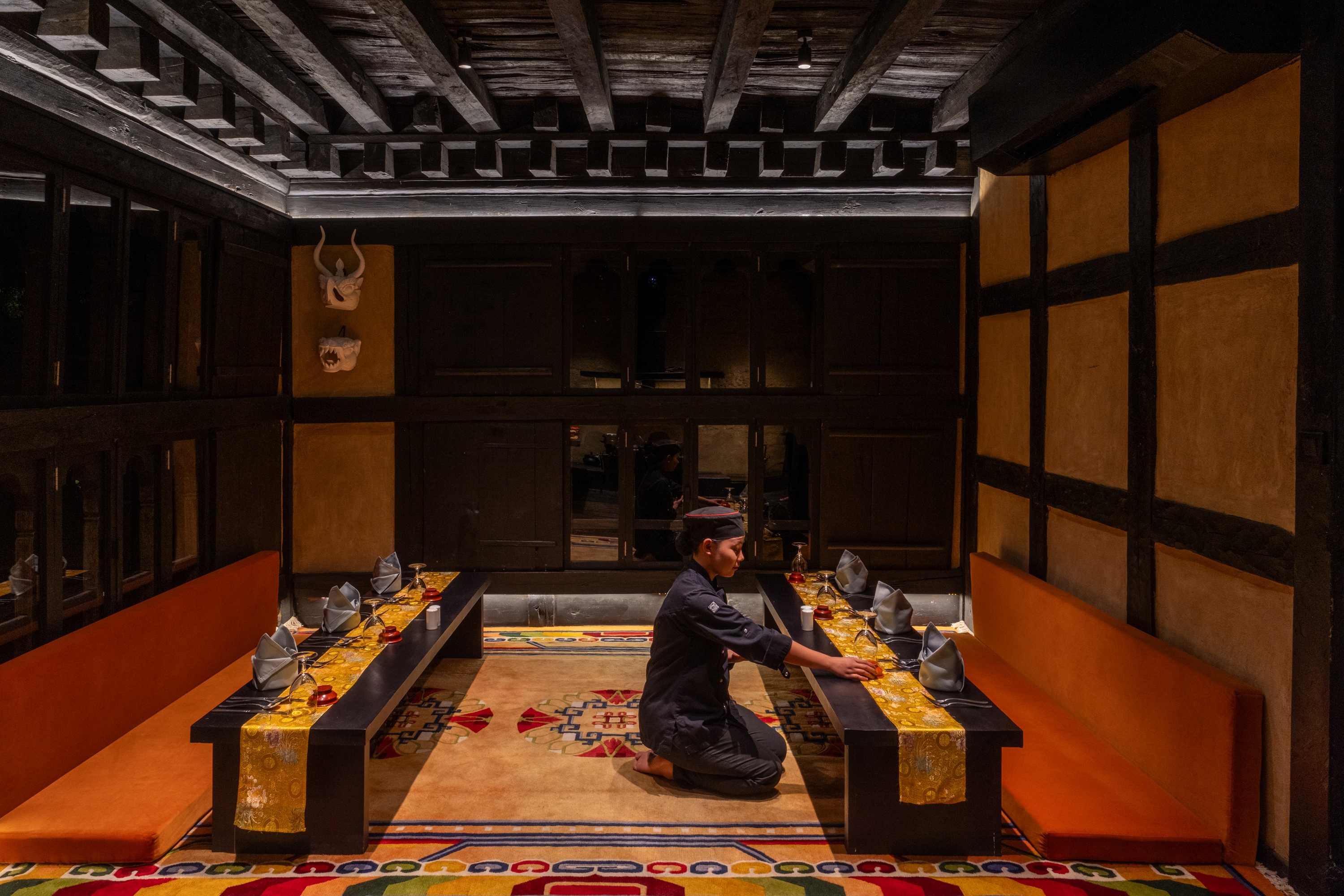 Chef at open kitchen at Pemako Punakha