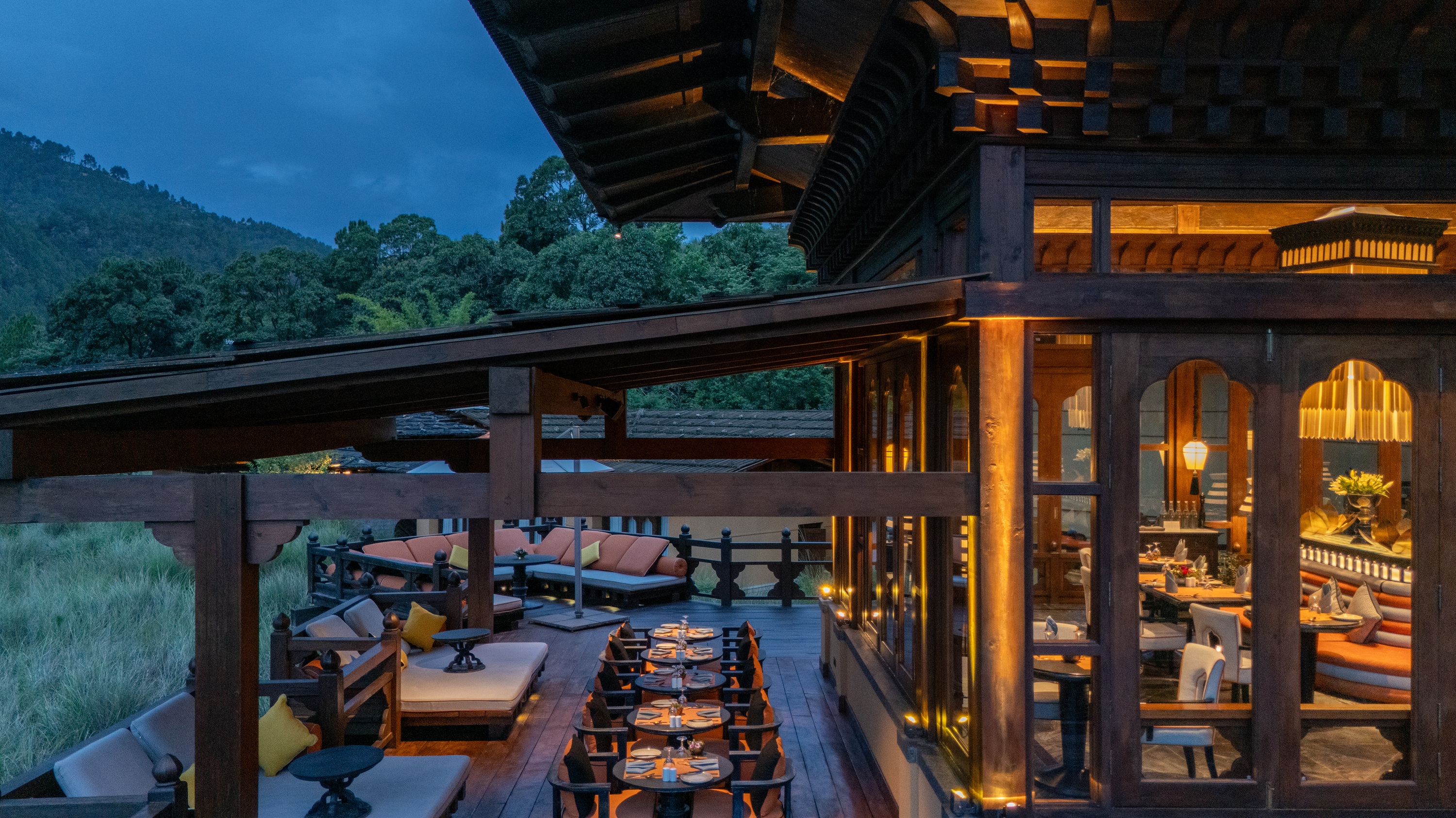 Dining terrace at dusk at Pemako Punakha