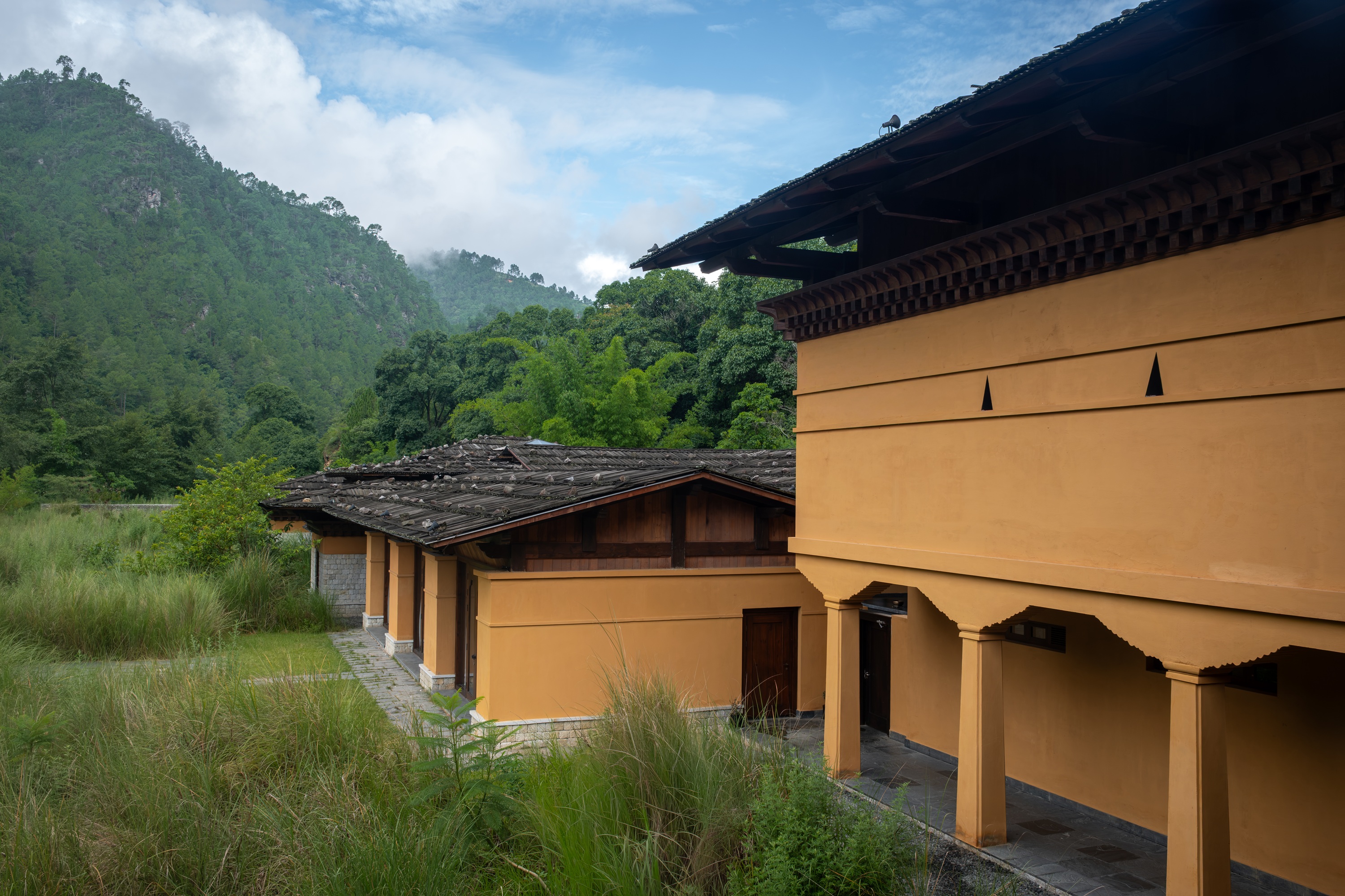 Garden building and mountains at Pemako Punakha