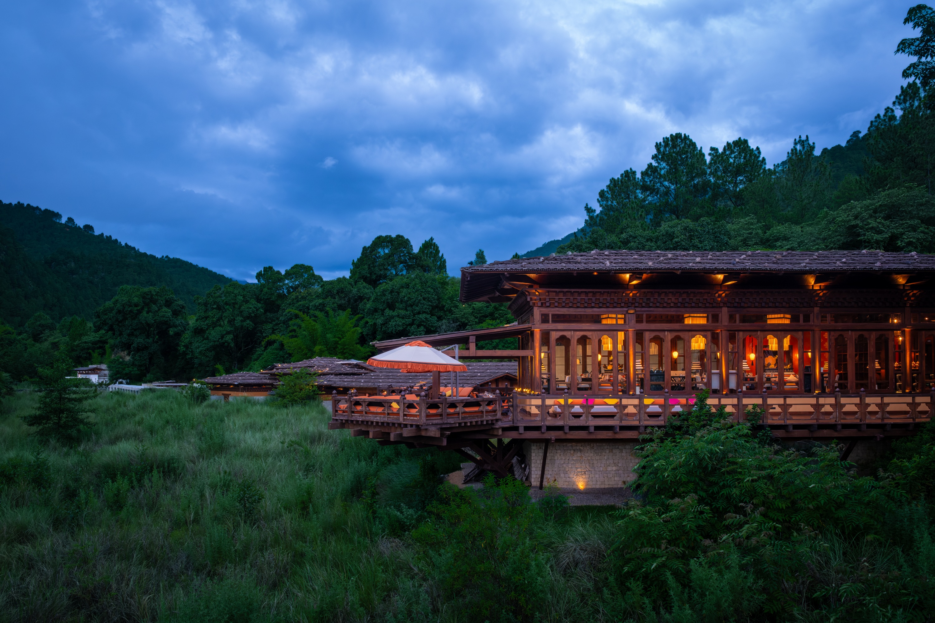 Riverside dining at dusk at Pemako Punakha