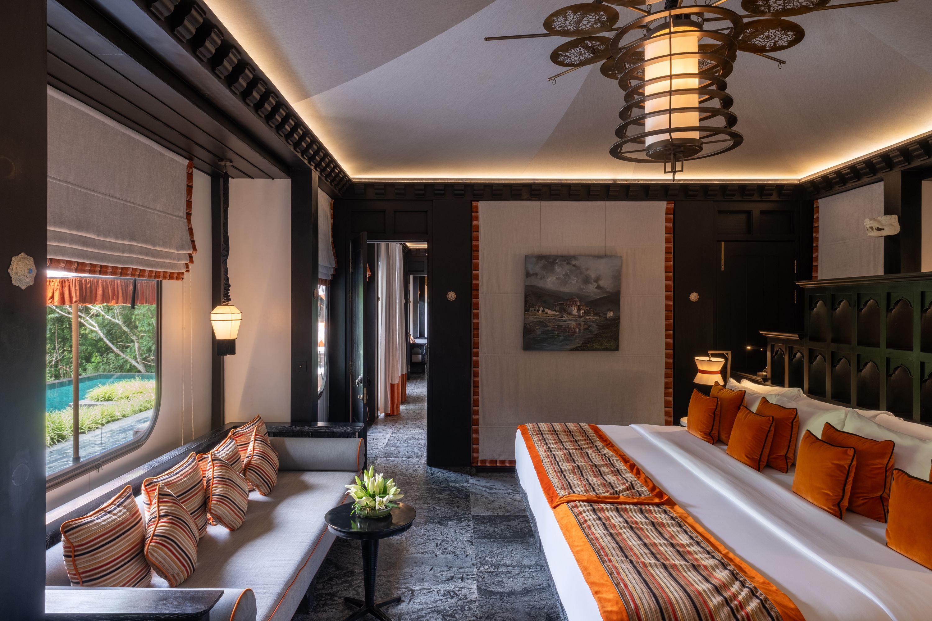 Villa bedroom with sofa at Pemako Punakha